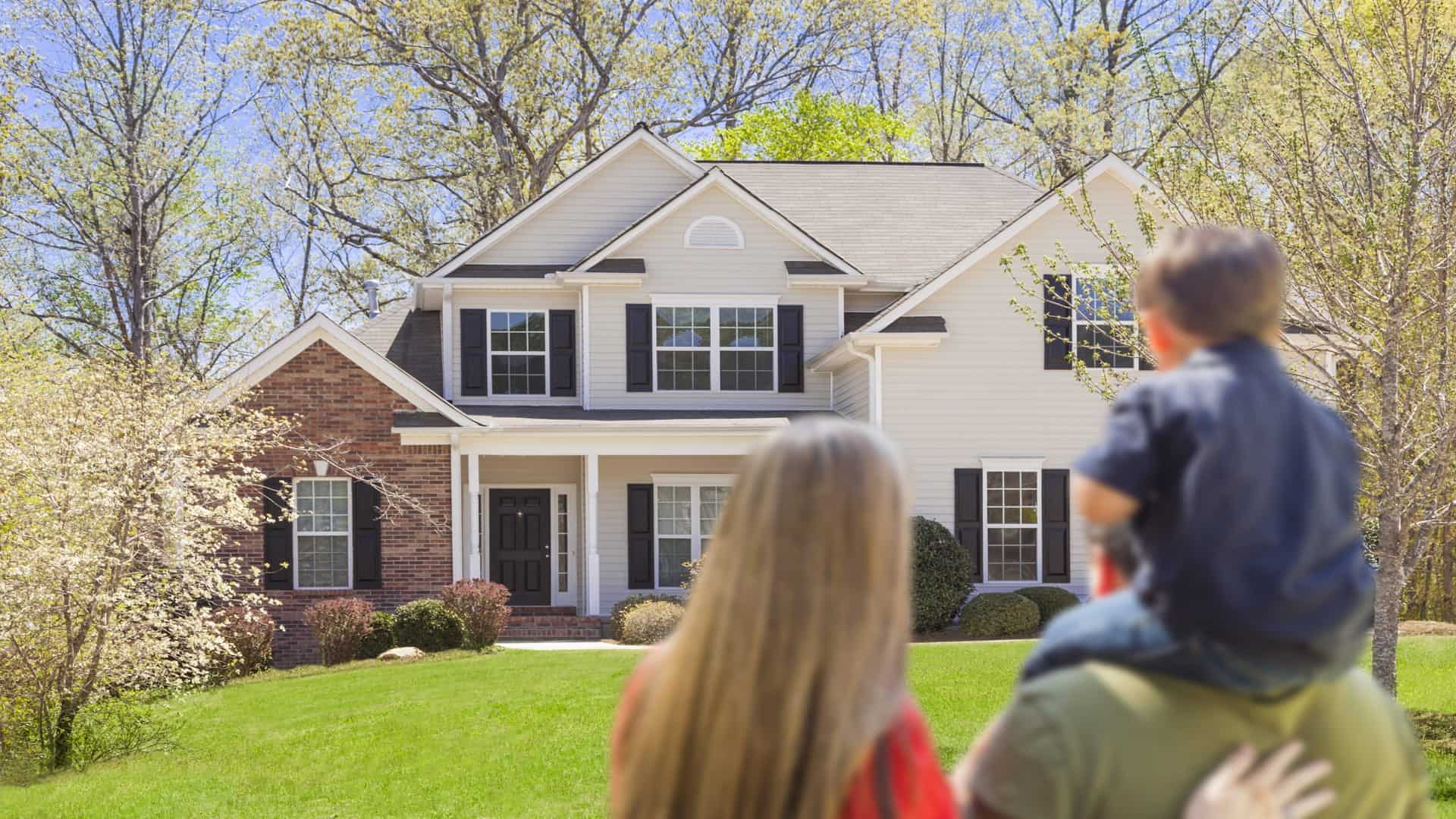 family-in-front-of-home